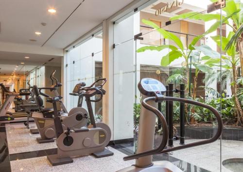 a gym with cardio machines in front of a building at Cidnay Santo Tirso - Charming Hotel & Executive Center in Santo Tirso