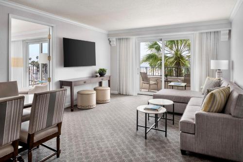 a living room with a couch and a table at Hyatt Regency Huntington Beach Resort and Spa in Huntington Beach