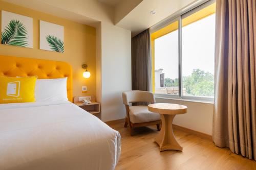 Cama o camas de una habitación en Bloom Hotel - Ranchi