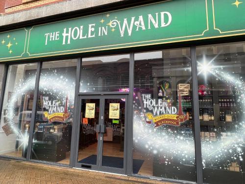 a store front with christmas lights in the windows at The Blenheim Mount Hotel in Blackpool