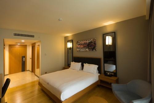 Katil atau katil-katil dalam bilik di Windyhill Hotel