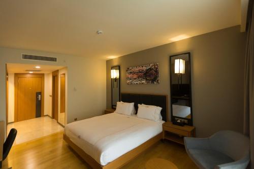 Ένα ή περισσότερα κρεβάτια σε δωμάτιο στο Windyhill Hotel