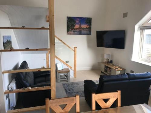 TV a/nebo společenská místnost v ubytování Sarahs Beachouse