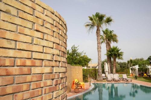Gallery image of VILLA LIBECCIO appartment with shared swimming pool, at 200 meters from the beach, solarium and private parking in Avola