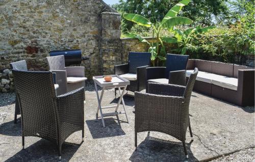 a group of chairs and a table in a garden at Cozy Home In Appeville in Appeville