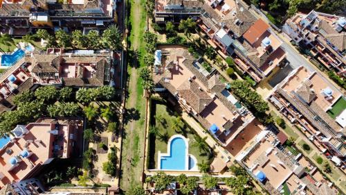 an aerial view of a house with a blue door at Luna Blanca Golf by EaW Homes in Estepona