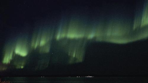 an image of the northern lights in the sky at Seljenes Cottage in Russenes