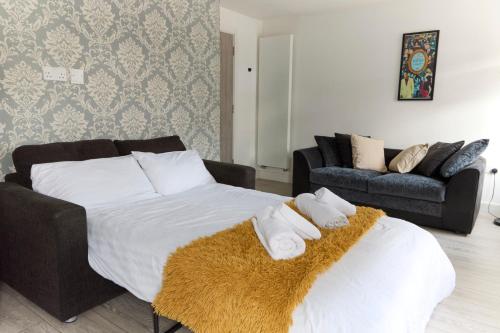 a bedroom with a large bed with towels on it at Remarkable 1-Bed Apartment in London in London
