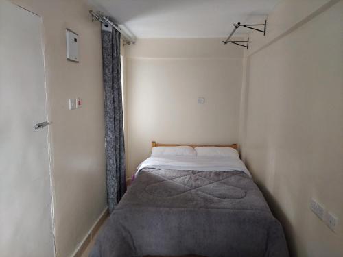 Un pat sau paturi într-o cameră la Kim's BNBs