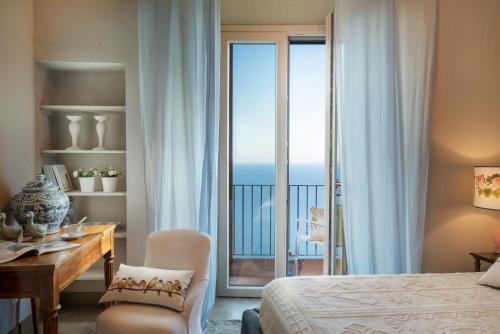 Postel nebo postele na pokoji v ubytování Sunset Populonia Home With Sea View, Ac, Wifi