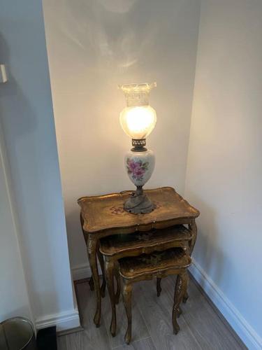 a lamp sitting on a table in a room at Cosy 2 Double Bed Apartment in Swords