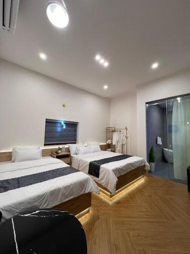 Postel nebo postele na pokoji v ubytování VILLA MINH HẬU