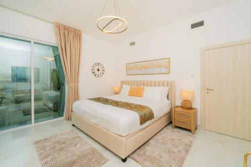 a bedroom with a bed and a large window at Dubai Marina - 1BHK Apartment in Dubai