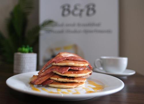 a stack of pancakes on a plate on a table at Bannview Bed & Breakfast in Portadown