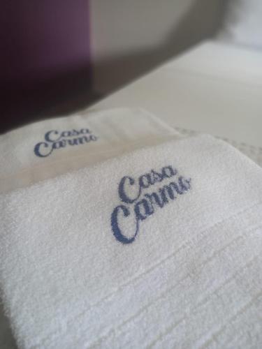 a white towel with the words canadian summit on it at Estalagem do Carmo in Pirenópolis