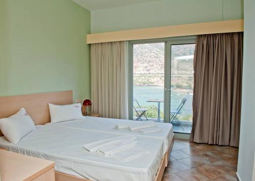 Cama o camas de una habitación en Resol Hotel