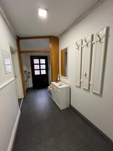 a bathroom with a washer and dryer on a wall at Ferienwohnung ENJOY 2 in Goslar