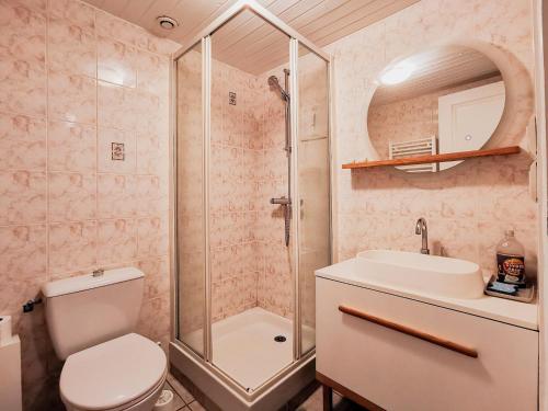 a bathroom with a shower and a toilet and a sink at Sainte Marine in Sainte-Marine