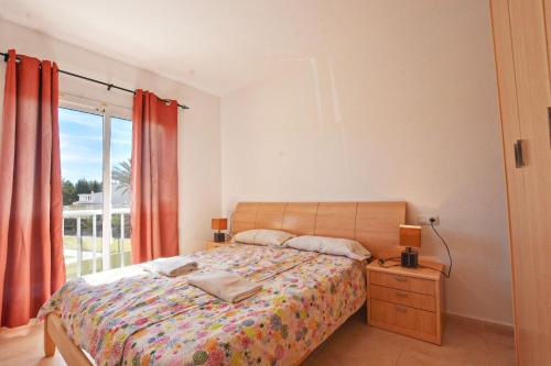 a bedroom with a bed and a window at Book Jet - Apartamento Tindaya Wifi & Pool in Costa Calma