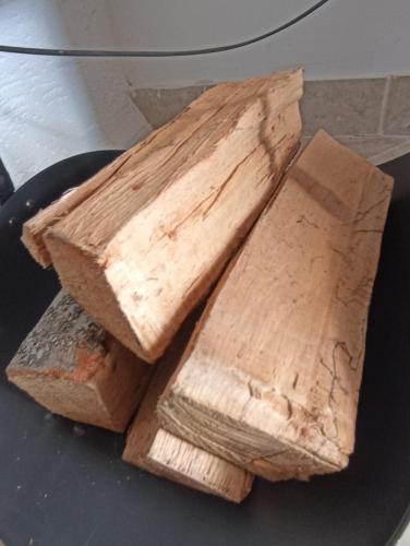 two pieces of wood sitting on a plate at GREEN VILLAGE Apartment in Gornji Orahovac