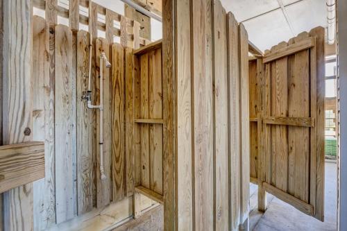 a room with wooden walls and wooden doors at Unit 304S at Tiffany's in Surf City