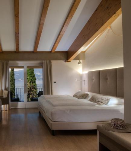 Postel nebo postele na pokoji v ubytování Hotel Galvani