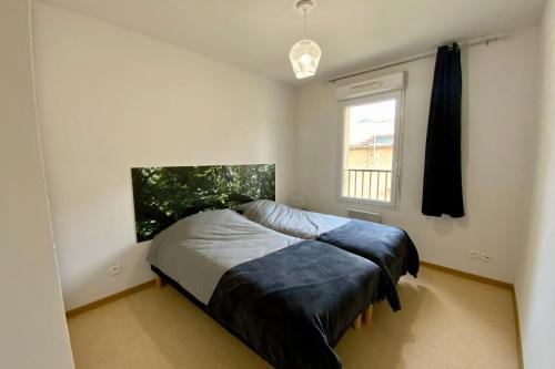 a bedroom with a bed and a window at Les Naïades I50 - 2 bedrooms for 5 people ! in Avène