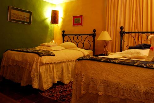 Ένα ή περισσότερα κρεβάτια σε δωμάτιο στο Hotel La Posada de San Antonio