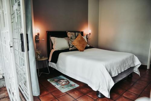 Ένα ή περισσότερα κρεβάτια σε δωμάτιο στο Amaziah Guesthouse