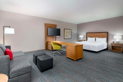 a hotel room with a bed and a desk at Hampton Inn and Suites Clayton/St. Louis-Galleria Area in Clayton