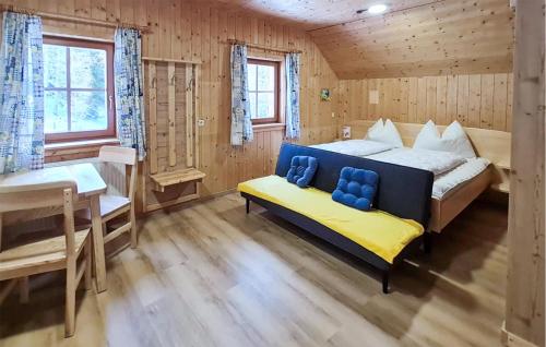 a bedroom with a bed and a bench in a room at Ferienhtte In Lachtal in Hinteralm