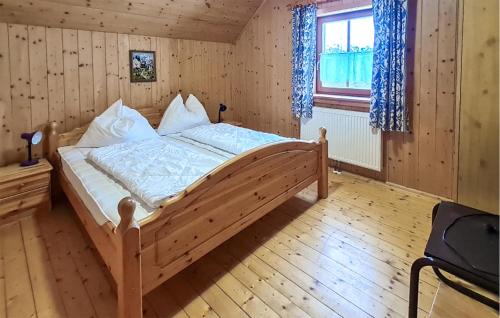 a bedroom with a large bed in a room at Ferienhuette In Lachtal in Hinteralm