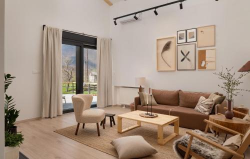 a living room with a couch and a table at Amazing Home In Rizvanusa in Gospić