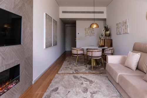 a living room with a couch and a table at Porto Deluxe Palace in Porto