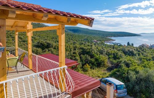 a balcony of a house with a view of the water at 4 Bedroom Amazing Home In Banj in Banj