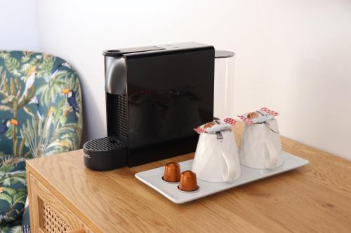 two penguins on a plate next to a television at Tour de Nesle La Rochelle Vieux Port 3 etoiles in La Rochelle
