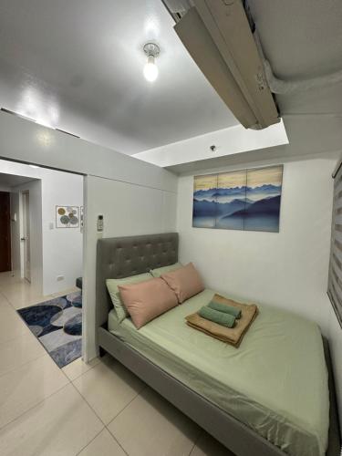 Postel nebo postele na pokoji v ubytování Shell Residences Staycation