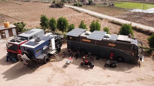 a truck with solar panels on the side of it at Hippie Land Nature Stay in Hampi