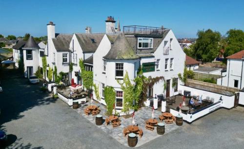 an aerial view of a large white house with tables at Abbotsford Hotel in Ayr