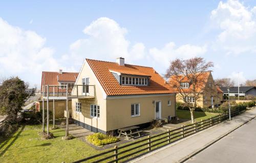 a white house with an orange roof at 3 Bedroom Awesome Home In Skagen in Skagen