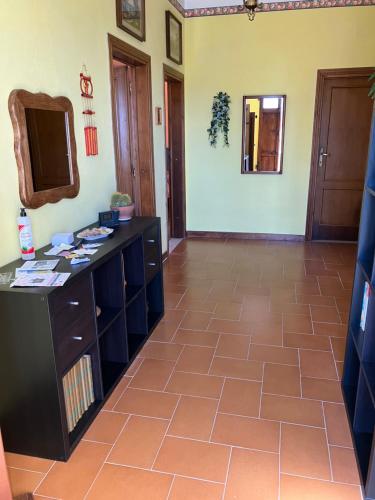a large room with a vanity and a mirror at B&B da Paola in Bardalone