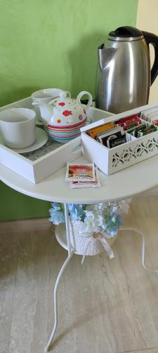 a white shelf with bowls and dishes on it at Le tre cime in Baranello