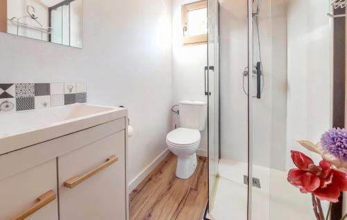 a bathroom with a toilet and a glass shower at Beautiful stacaravan In Xtiva With Kitchenette in Xàtiva