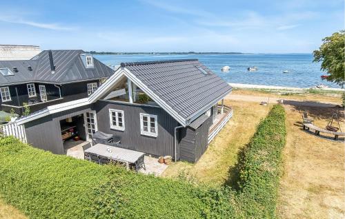 an aerial view of a house on the beach at 2 Bedroom Cozy Home In Sjølund in Sjølund