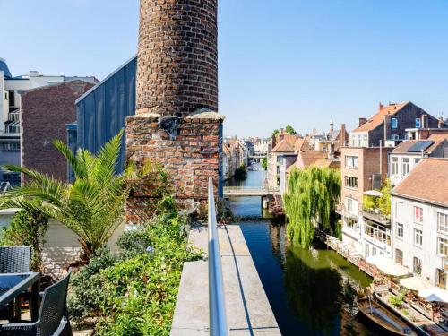 a view of a canal in a city at Budget Rooms by Ghent River in Ghent