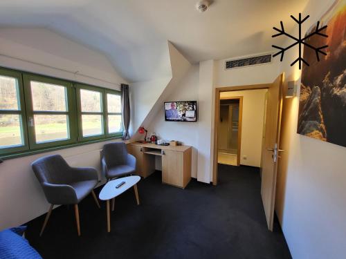 TV a/nebo společenská místnost v ubytování Pension Jitřenka Hřensko Bed & Breakfast
