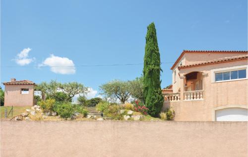 a house with a fence in front of it at 4 Bedroom Beautiful Home In Calvisson in Calvisson