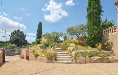 a set of stairs in a garden with plants at 4 Bedroom Beautiful Home In Calvisson in Calvisson