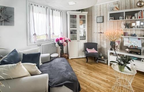 a living room with a couch and a table at Amazing Home In Les Sables-D'olonne in Les Sables-dʼOlonne