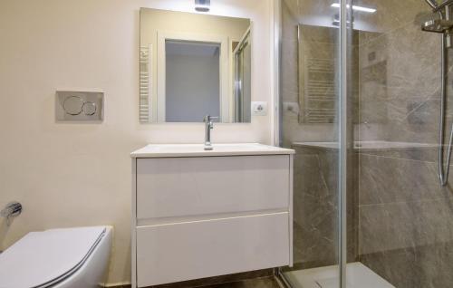 a white bathroom with a sink and a shower at Nice Apartment In Zoagli With Kitchen in Zoagli